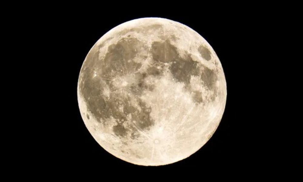 Full moon phase glowing brightly in the night sky, symbolizing peak energy, release, and new opportunities