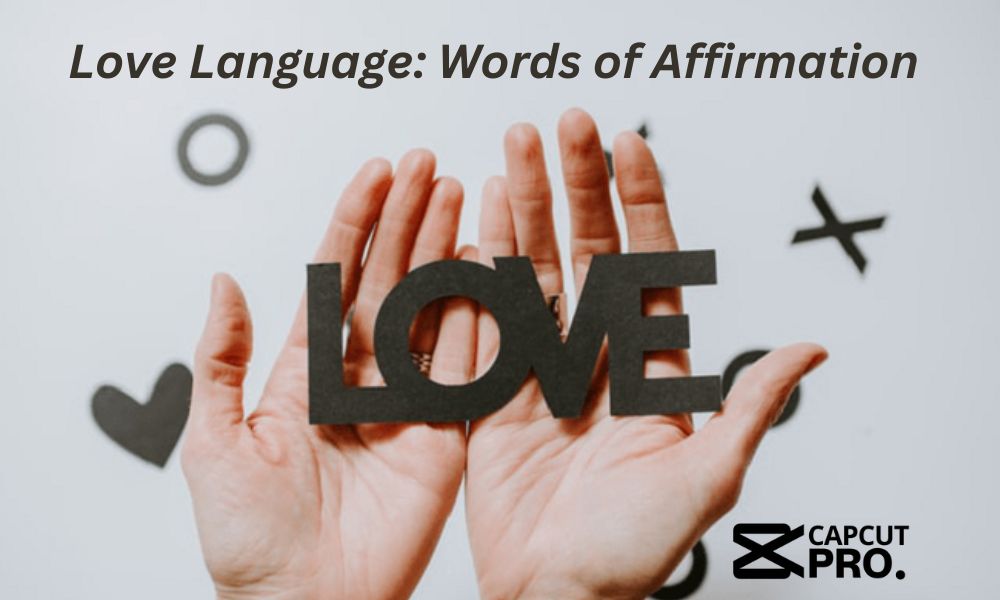 Hands holding the word LOVE symbolizing the Words of Affirmation love language